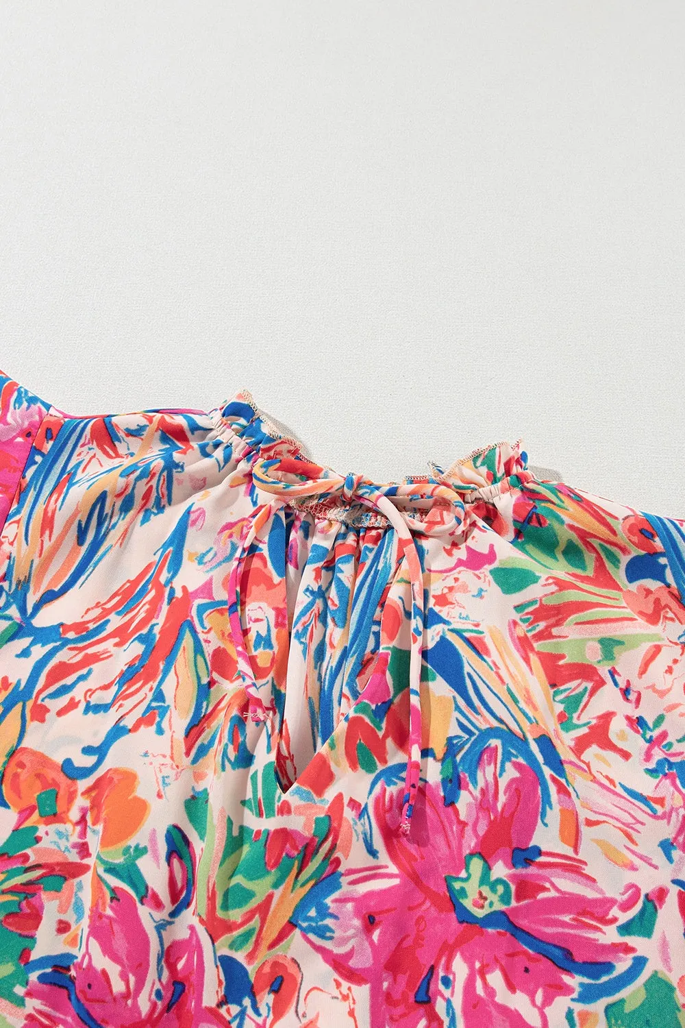 Bella Ruffled Printed Tie Neck Cap Sleeve Blouse