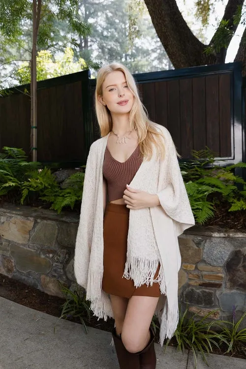 Embroidered Tassel Ponchos.