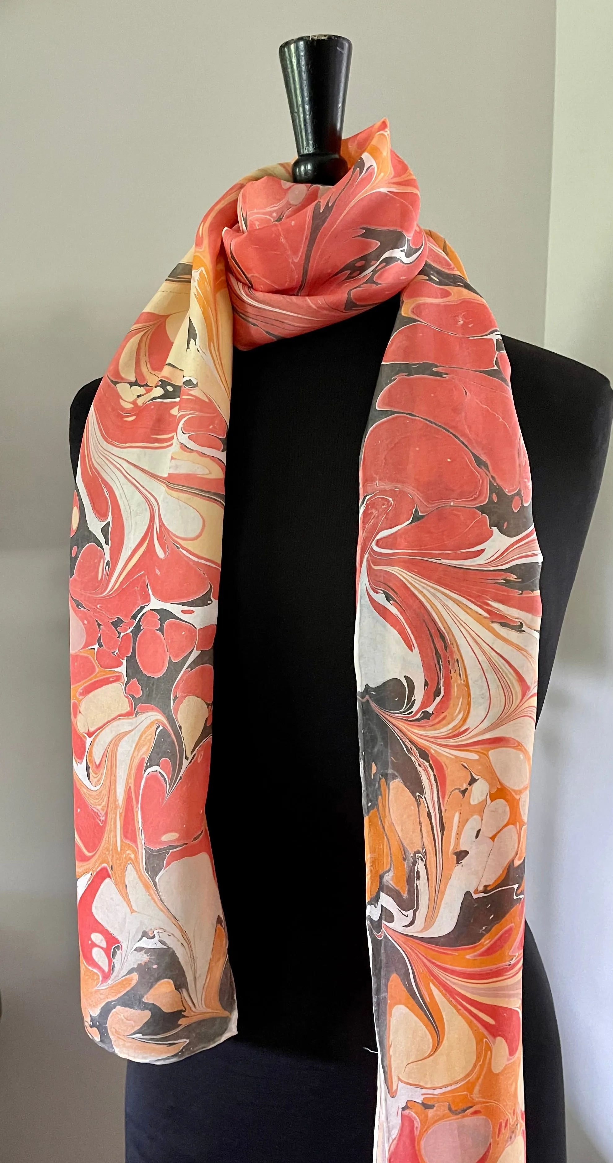 Orange very random water marbled 8mm Habotai silk.  Hang on the wall, use as a table runner or wear this unique piece