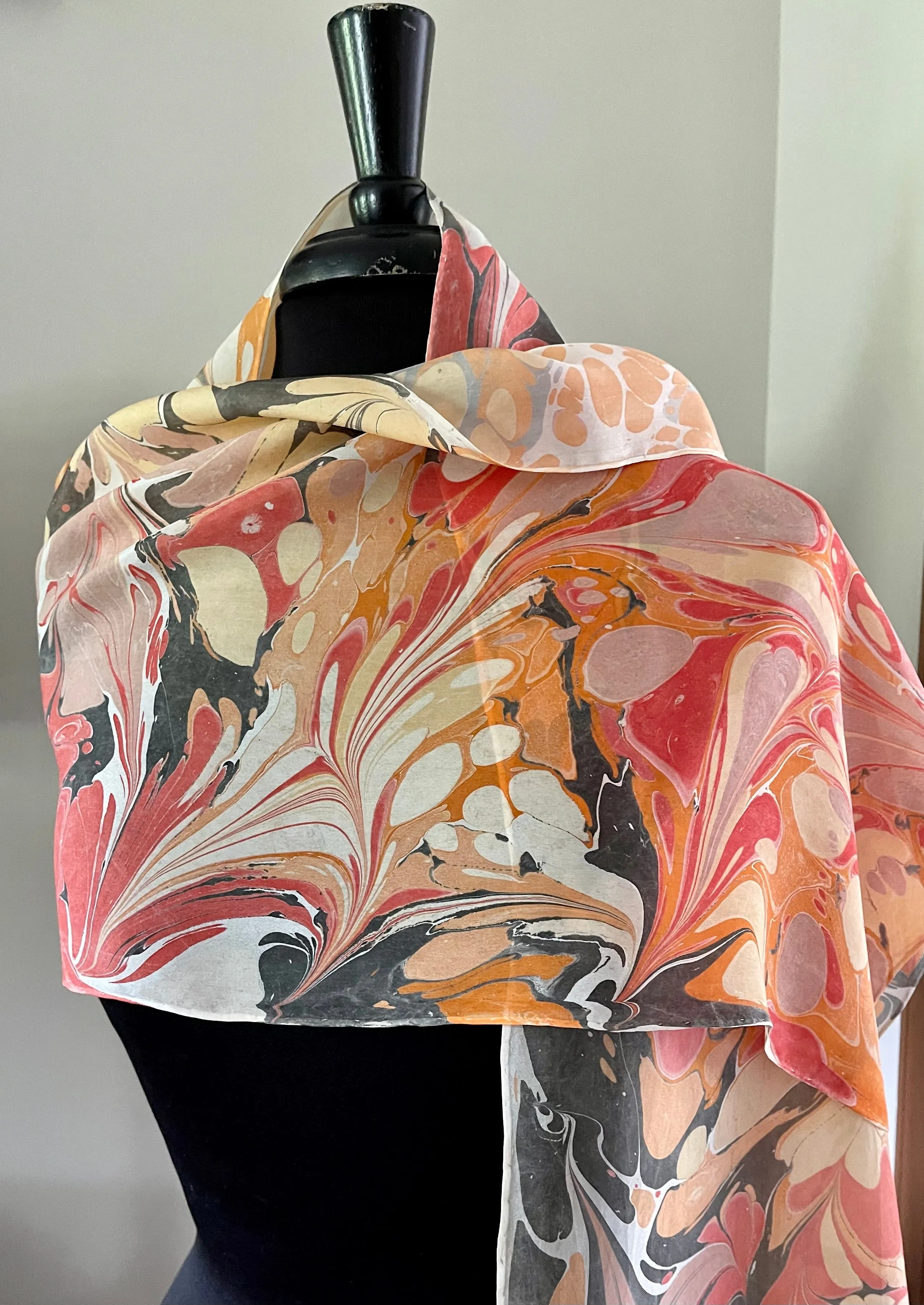 Orange very random water marbled 8mm Habotai silk.  Hang on the wall, use as a table runner or wear this unique piece