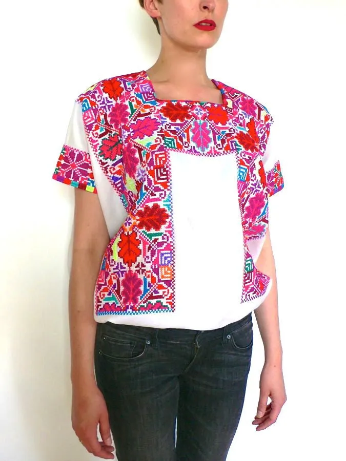 Pink red and white cross-stitched blouses Mexico