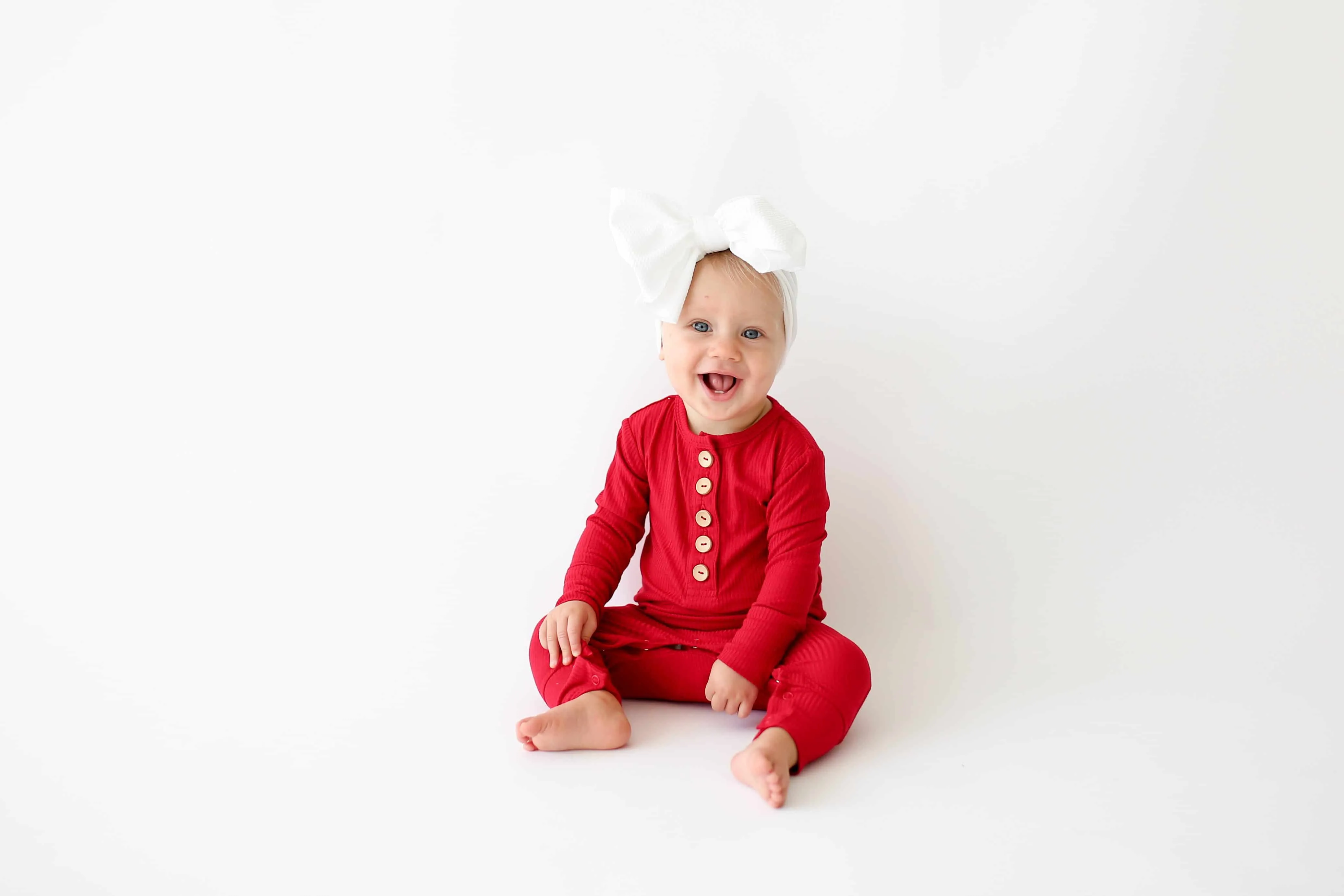 Posh Peanut Crimson Ribbed Long Sleeve Henley Ruffled Romper