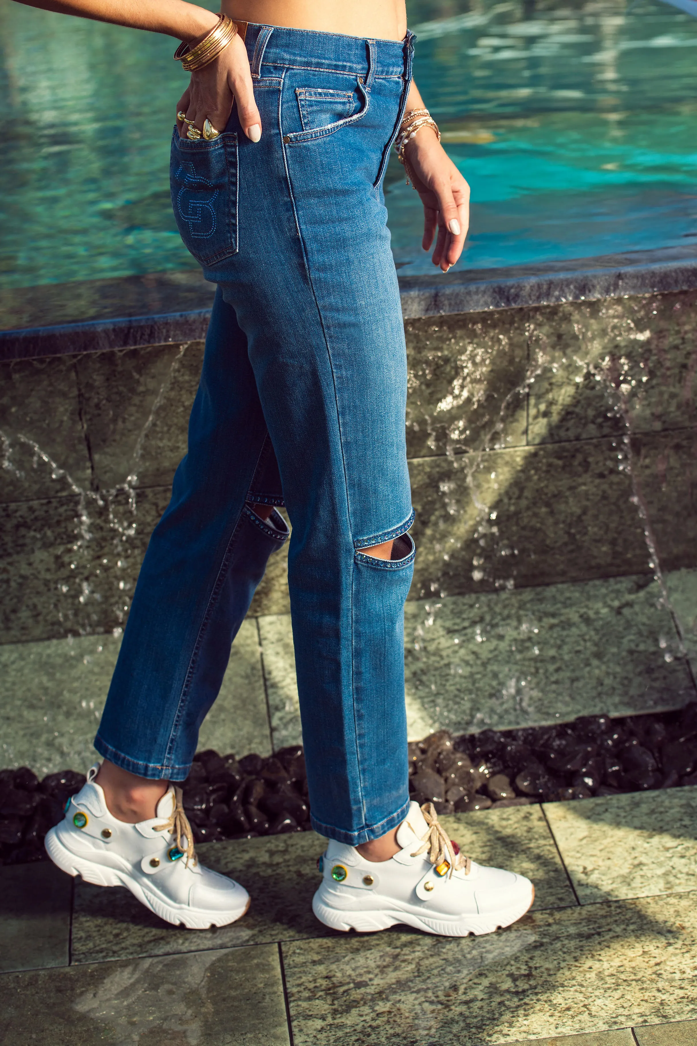 White sneakers with gemstone embellishments